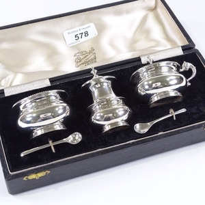 A 3-piece sterling silver cruet set, with blue glass liners,...