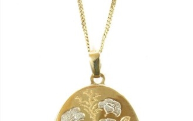 A 9ct gold oval locket pendant