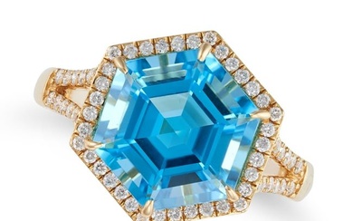 A BLUE TOPAZ AND DIAMOND RING set with an hexagonal step cut blue topaz of 5.34 carats in a border
