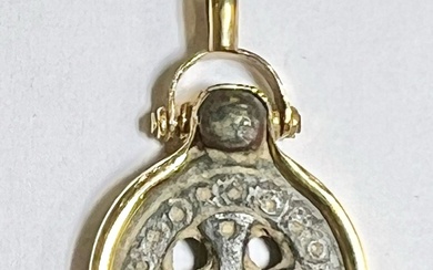 A BYZANTINE BRONZE BUCKLE WITH CROSS SET IN A GOLD...