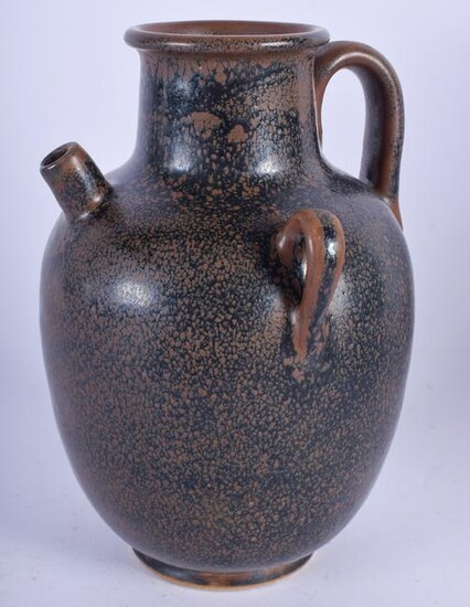 A CHINESE BROWN GLAZED POTTERY EWER. 19 cm high.