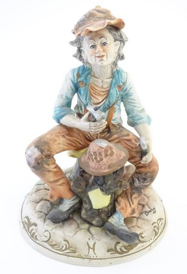 A Capodimonte figure of an elderly man with tools