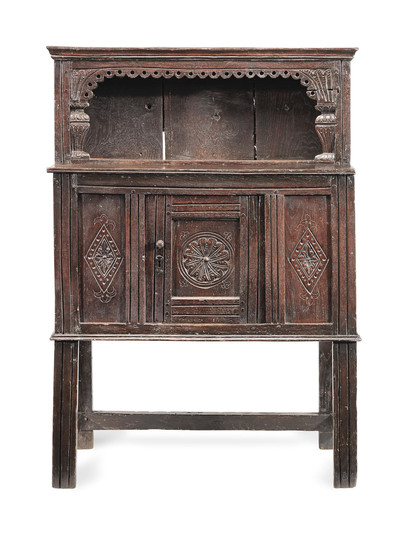 A Charles I joined and boarded oak 'mural' livery cupboard, West Country, circa 1640