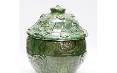 A Chinese Buddhist green glazed jar and cover, Song-Yuan dyn...