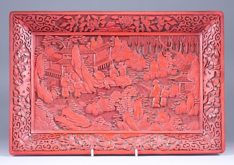 A Chinese Cinnabar Lacquer Tray, deeply carved with figures...