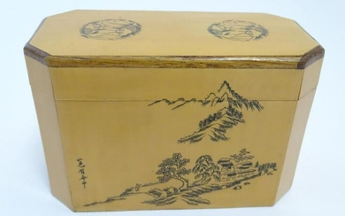 A Chinese blonde wood two sectional caddy decorated