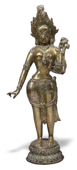 A Chinese bronze figure of Parvati, early 20th century, cast standing with left hand raised issuing a lotus stem from her palm which flowers beside her shoulder, 44cm high