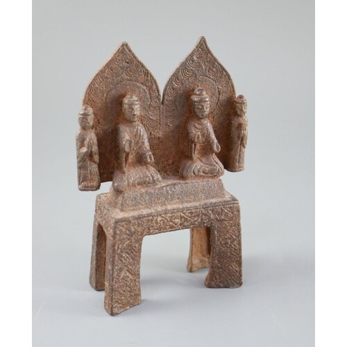 A Chinese cast iron votive group of two Buddhas and two atte...