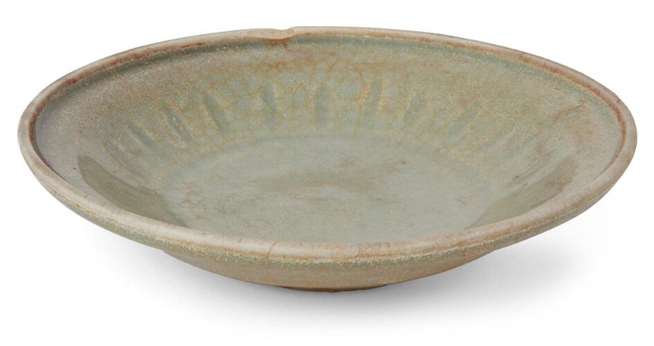 A Chinese stoneware Longquan celadon dish, Yuan dynasty, decorated to...
