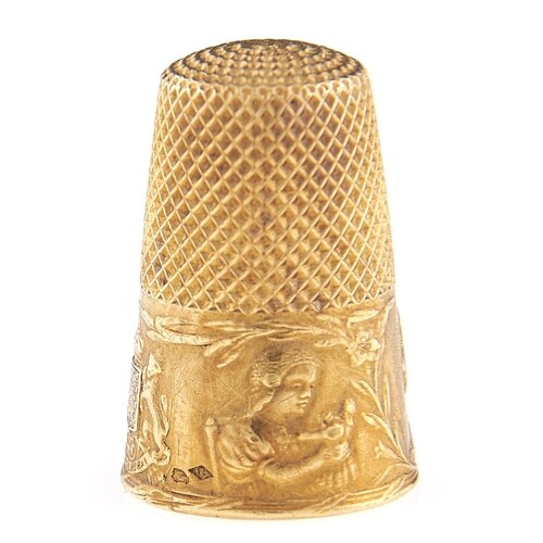 A French gold thimble, c1900, embossed with the heads of chi...