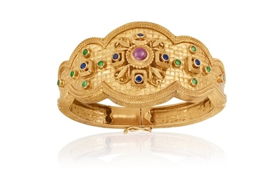 A GEM-SET BANGLE, BY ILIAS LALAOUNIS Of hinged design, the ...