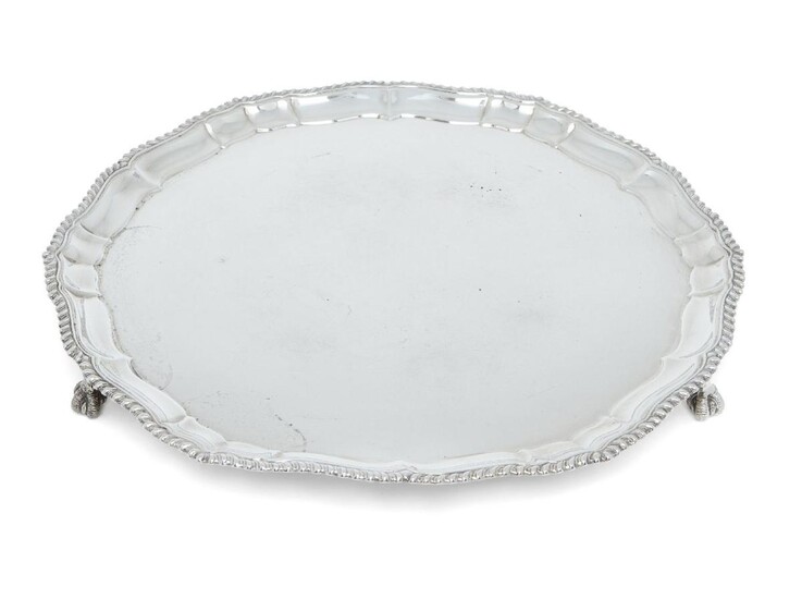 A George VI silver salver, Sheffield, 1937, Atkin Bros, of shaped rounded form, designed with gadrooned rim and raised on three claw and ball feet, 34.5cm dia., approx. weight 37.3oz