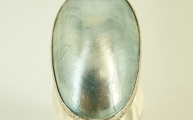 A LARGE SHELL AND STERLING SILVER RING