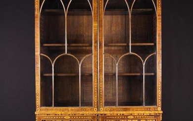 A Large 19th Century Inlaid Mahogany Bookcase. The upper section having two glazed doors with lancet