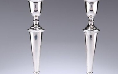 A PAIR OF GEORGE V SILVER CANDLESTICKS