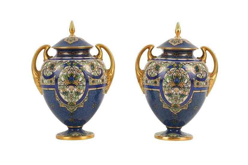 A PAIR OF ROYAL WORCESTER PORCELAIN URNS AND COVERS, LATE 19TH CENTURY