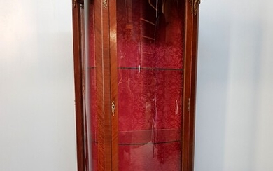 A Transitional style mahogany veneered glass cabinet with ormolu decoration,...