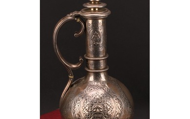 A Victorian silver globular wine ewer, chased with Green Man...