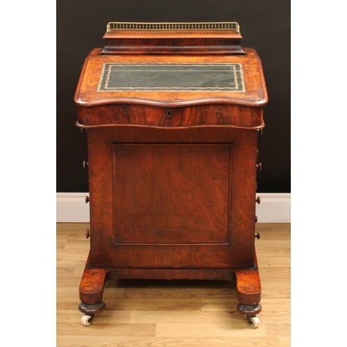 A Victorian walnut Davenport desk, hinged concave rectangula...