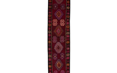 A WOOL RUNNER, IRAN, C.1970s, 434 x 92cm the central field ...