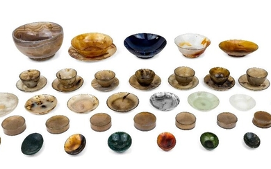 A collection of agate dishes and bowls, late 19th/20th century, including moss, corniola and banded specimens, the largest bowl - 15cm diameter (A LOT)