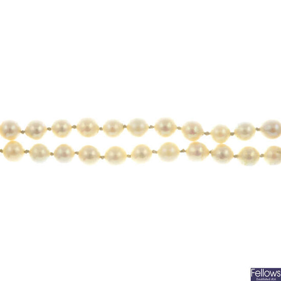 A cultured pearl two-row bracelet, with emerald clasp.