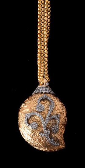A gold coloured diamond pendant