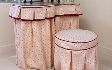 A kidney shaped fabric topped dressing table together with pouffe,...