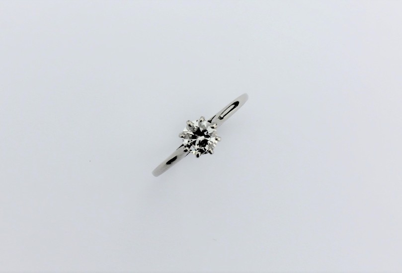 A ladies single stone diamond ring, claw set and mounted in ...