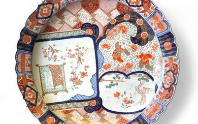 A large Japanese Imari Charger with lobbed rim and cartouche...