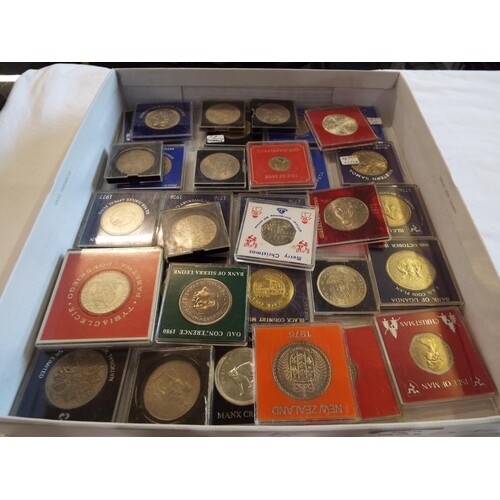 A large selection of crowns and coins in Perspex cases to in...