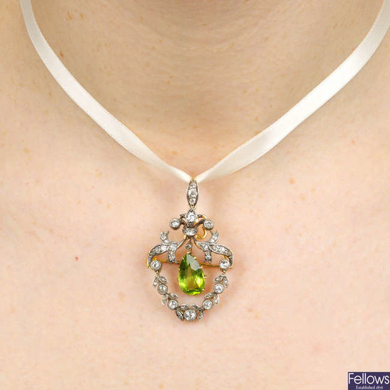 A late Victorian silver and gold, pear-shape peridot and old-cut diamond pendant.