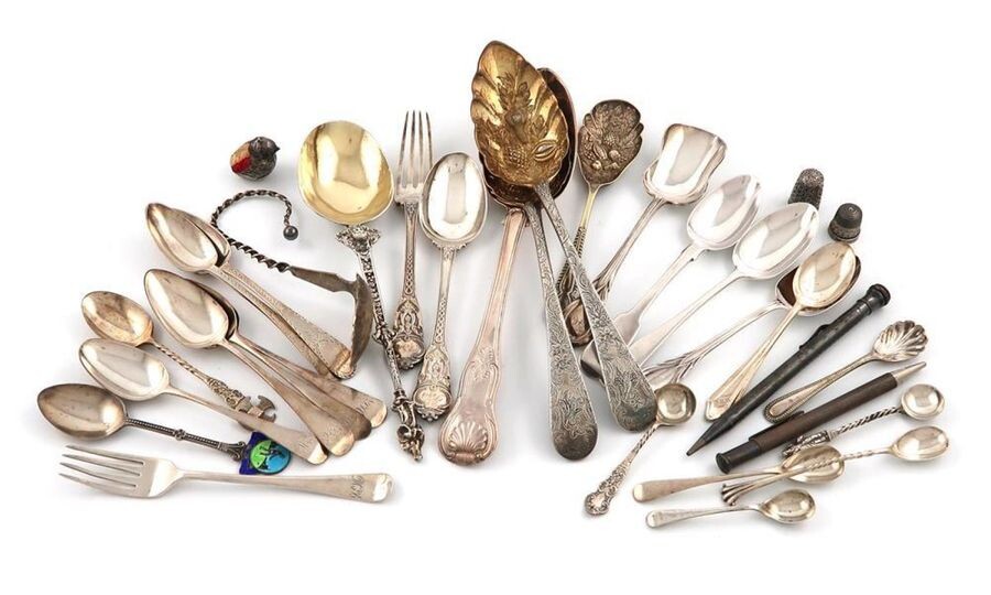 A mixed lot of silver items, various dates and makers, comprising: an Edwardian small pin cushion, modelled as a chick emerging from a shell, by S. Mordan and Co, Chester 1908, a table spoon, a pair of berry spoons, a continental spoon, two thimbles...