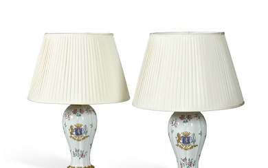 A pair of Continental porcelain famille verte baluster vases now mounted as lamps, circa 1900