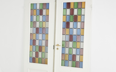 A pair of doors, 1960s, multicoloured stained glass, solid wood, later painted in white, later handles and locks.
