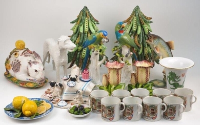 A quantity of English and Continental ceramics, 20th century, to include; a near pair of Meissen parrots on perches, tallest 31.5cm high, a Nymphenburg figure of a dog, 21.5cm high, nine WW1 commemorative mugs, a Meissen style porcelain vase with...