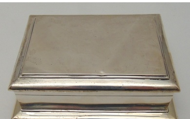 A rectangular hallmarked silver cigarette box with hinged co...