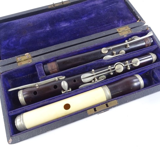 A rosewood and ivory 3-section flute with nickel-plate mount...