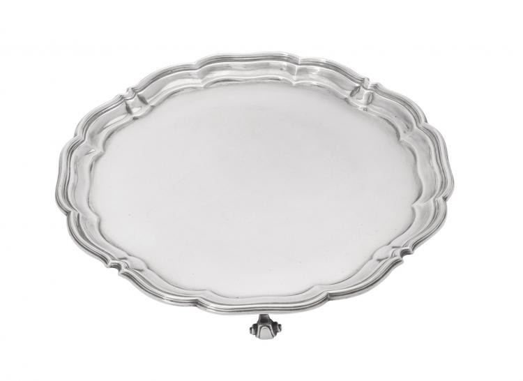 A silver shaped circular salver by Harrison Brothers & Howson