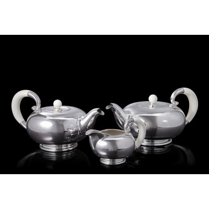 A silver tea and coffee set comprising a teapot, a coffee pot and a milk jug. Ivory handles. Alessandria, 1940...