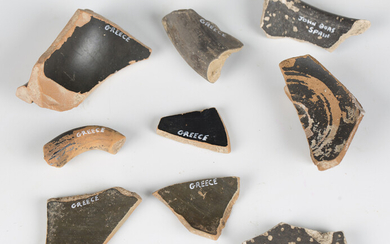 A small collection of Roman and Greek pottery fragments, including four pieces of impressed Gaulish