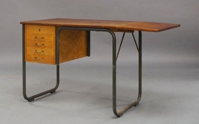 A teak desk, c.1960, the rectangular top, with single drop leaf extension, above a bank of five drawers on tubular lacquered supports, 67.5cm high, 86cm wide, 115cm wide extended, 54cm deep