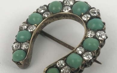 A turquoise and diamond brooch, in the form of a horsehoe