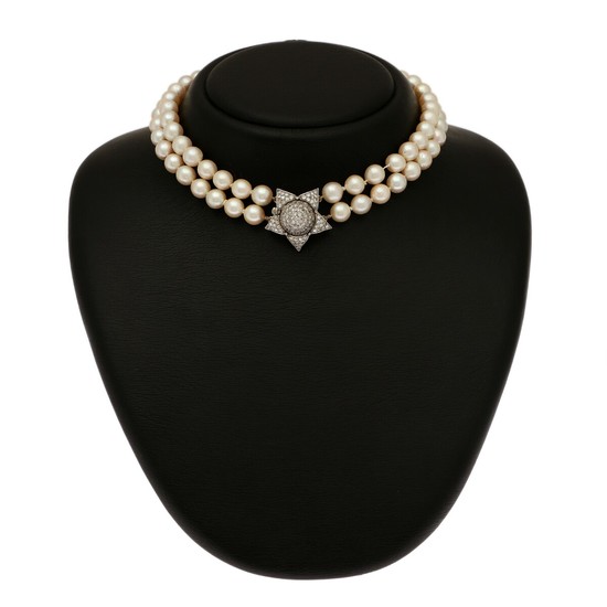 A two-strand pearl necklace set with numerous cultured pearls and a clasp set with numerous diamonds, mounted in 18k white gold. L. 36 cm.