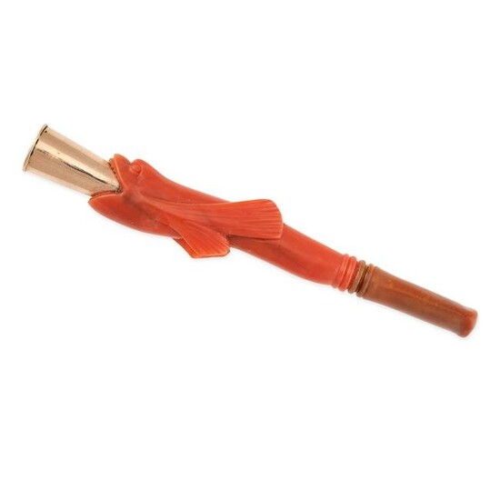 AN ANTIQUE CARVED CORAL CIGARETTE HOLDER in yellow