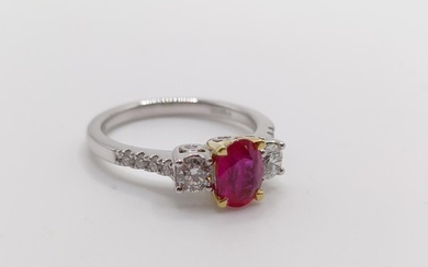 An 18ct white gold, oval ruby and RBC diamond trilogy ring w...