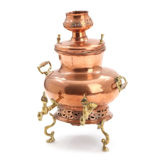 An 18th century copper and brass samovar with two taps. Stamped. H. 41 cm.