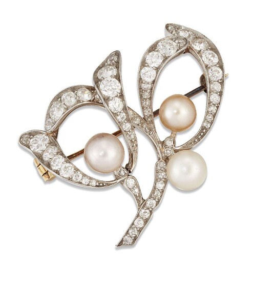 An Art Nouveau pearl and diamond brooch, modelled as a sprig of mistletoe set throughout with old-brilliant and old-cut diamonds with three pearl berries, mounted in gold and platinum, width 3.3cm Please note that the pearls have not been tested...