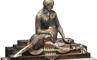 An Art Nouveau silver-gilt bronze of a lady playing with a cat on a marble base, Georges Lavroff