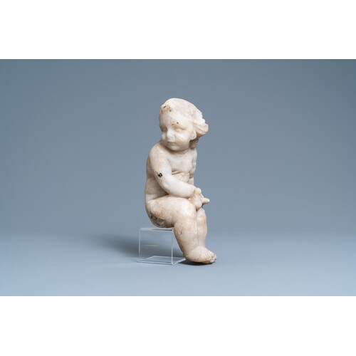 An alabaster figure of a putto with a bird on the knee, 17th...